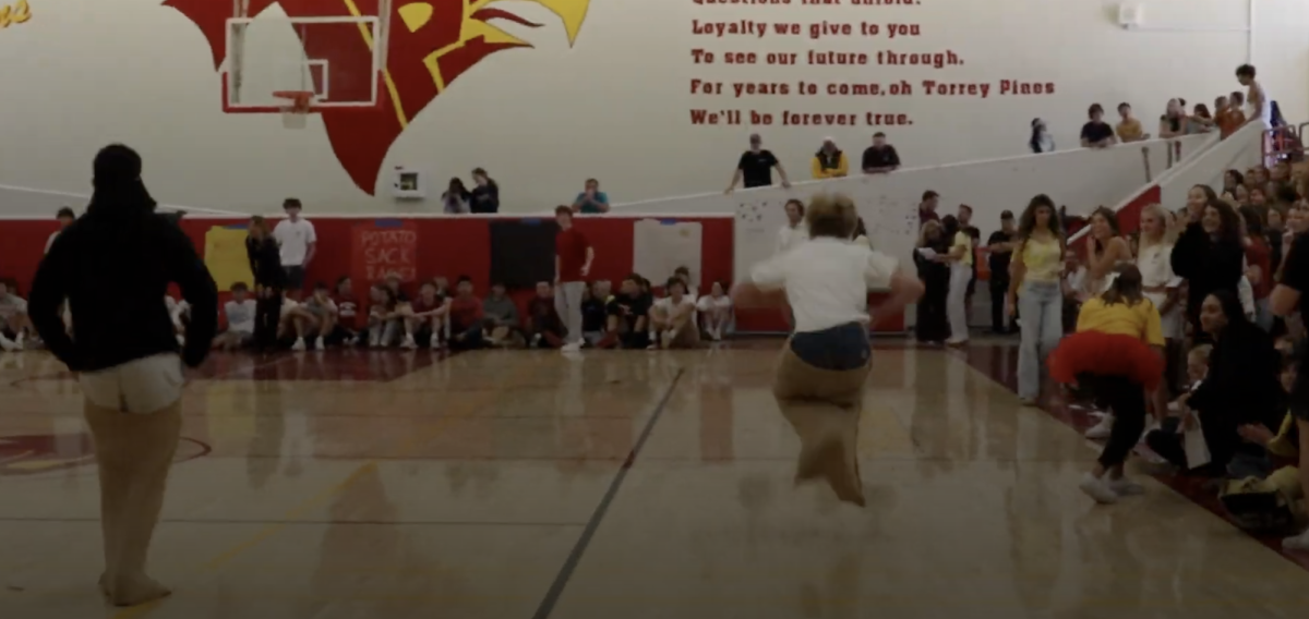 Students participate in a sack race at the spring pep rally. Reporters covered a recap of the latest pep rally. Photo courtesy of Cade Barber. 